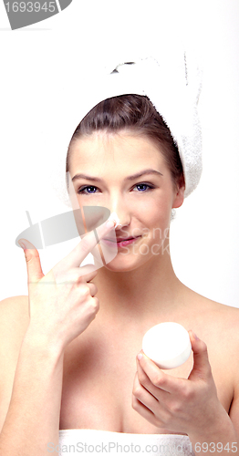 Image of young beautiful woman with a towel doing wellness