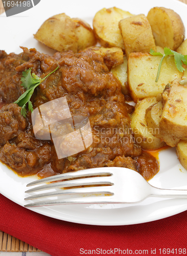 Image of Beef madras and potato curry