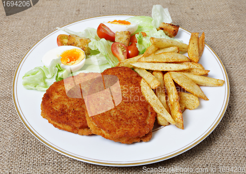 Image of Breaded Chicken steak fries and salad