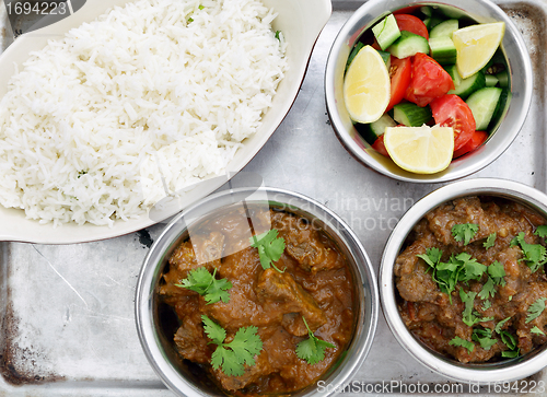 Image of Beef curries with salad and rice