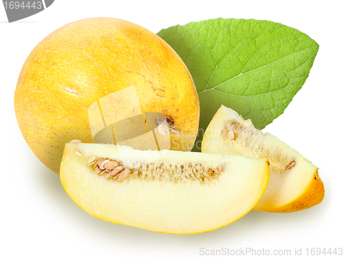 Image of fresh yellow melon with green leaf