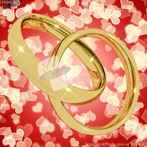Image of Gold Rings On Heart Bokeh Background Representing Love Valentine