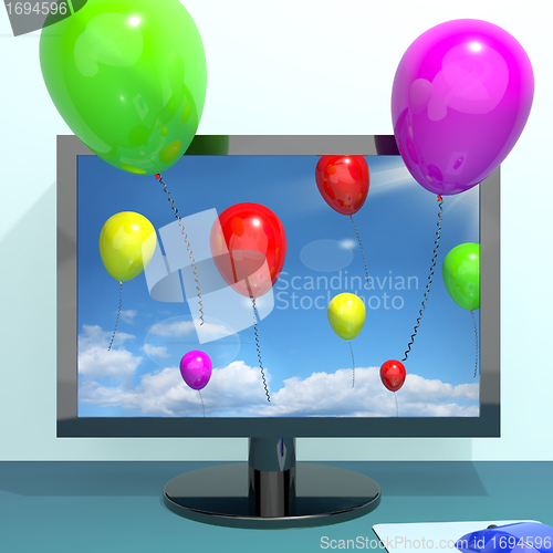 Image of Festive Colorful Balloons In The Sky And Coming Out Of Screen Fo