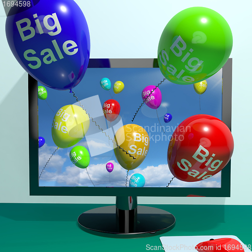 Image of Sale Balloons Coming From Computer Showing Promotion Discount An