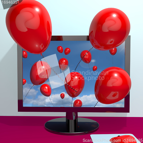Image of Red Balloons In The Sky And Coming Out Of Screen For Online Gree