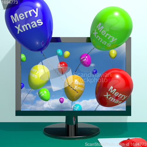 Image of Colorful Balloons With Merry Xmas From Computer Screen For Onlin