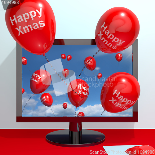 Image of Red Balloons With Happy Xmas From Computer Screen For Online Gre