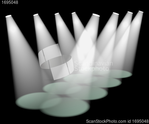 Image of Eight White Spotlights In A Row On Stage For Highlighting Produc