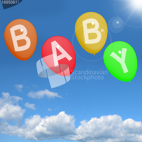 Image of Baby Balloons In Sky Showing Newborn Parenting Or Motherhood