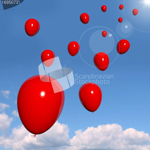 Image of Festive Red Balloons In The Sky For Celebration