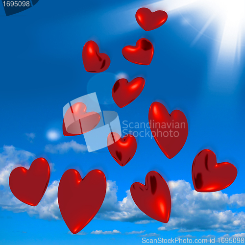 Image of Metallic Red Hearts Falling From The Sky Showing Love And Romanc