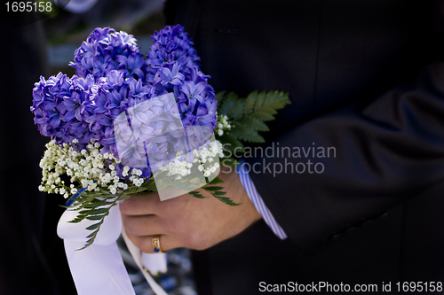 Image of Man hold flowers