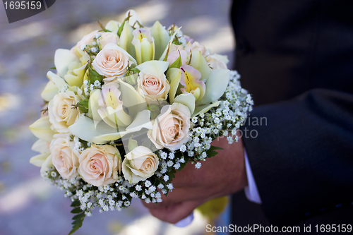 Image of Man hold flowers
