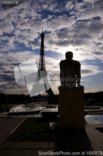 Image of Backlit Eiffel Tower with statue