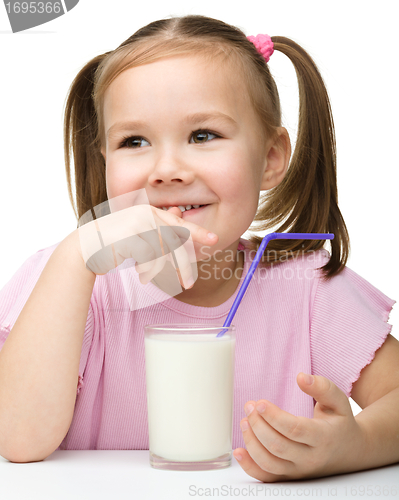 Image of Cute little girl with a glass of milk