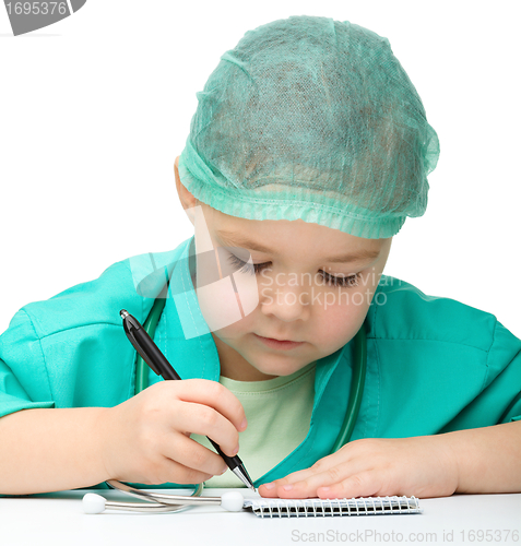 Image of Cute little girl is playing doctor