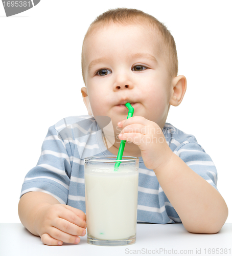 Image of Cute little boy with a glass of milk