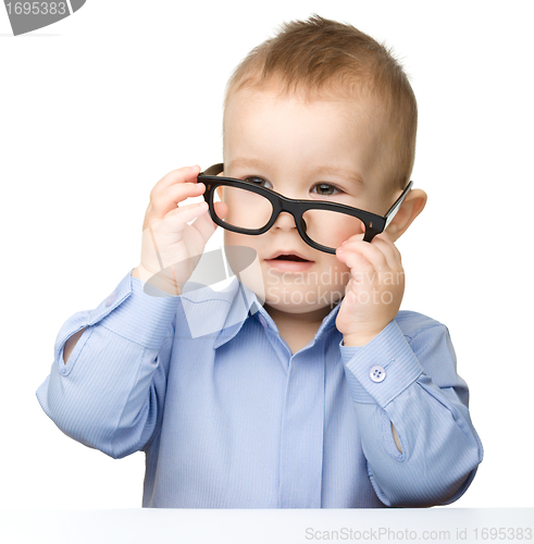 Image of Portrait of a cute little boy wearing glasses