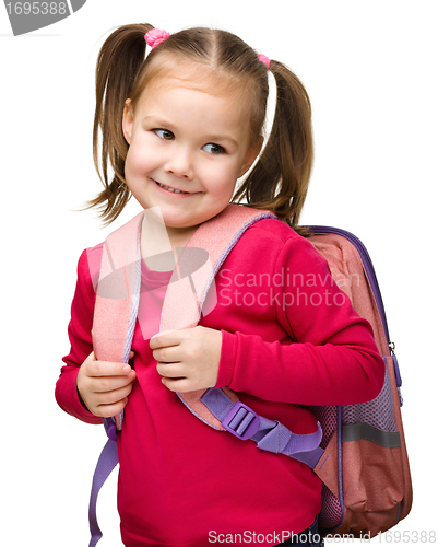 Image of Portrait of a cute schoolgirl with backpack