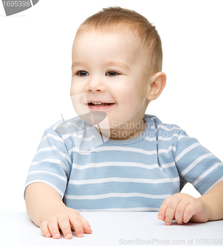 Image of Portrait of a cute and pensive little boy