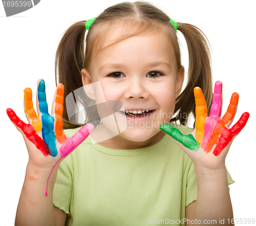 Image of Portrait of a cute girl with painted hands