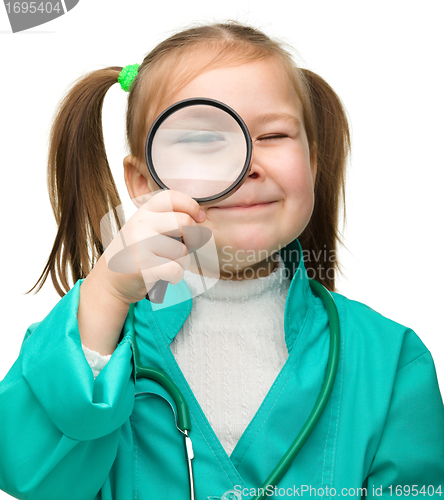 Image of Little girl is playing doctor