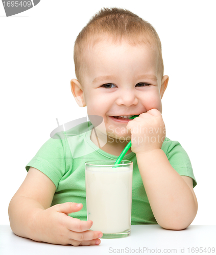 Image of Cute little boy with a glass of milk