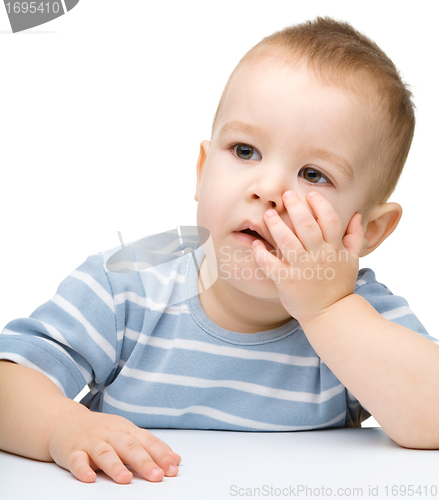 Image of Portrait of a cute and pensive little boy