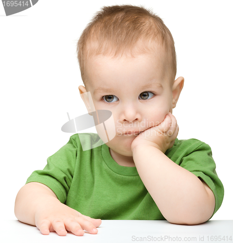 Image of Portrait of a cute and pensive little boy