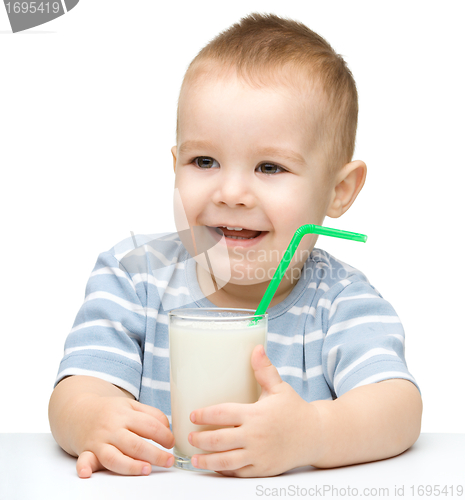 Image of Cute little boy with a glass of milk
