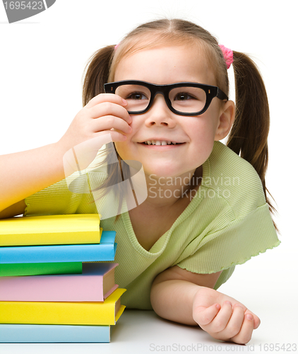 Image of Cute little girl with books