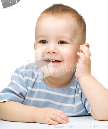 Image of Portrait of a cute and pensive little boy
