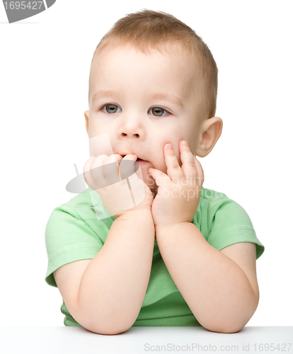 Image of Portrait of a cute and pensive little boy