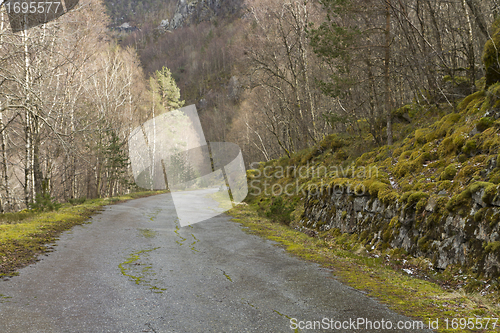 Image of run-down road in rural landscape