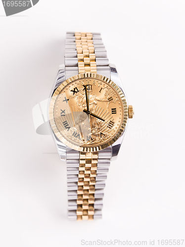 Image of Gold and stainless steel mans watch