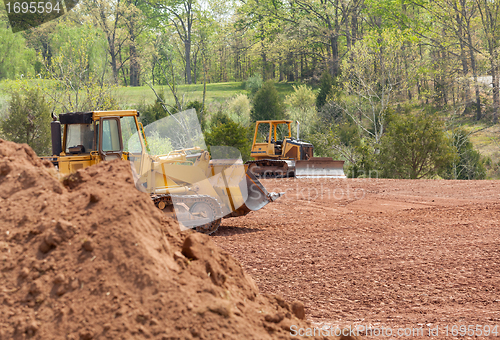 Image of Large earth mover digger clearing land