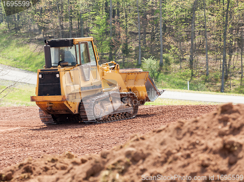 Image of Large earth mover digger clearing land