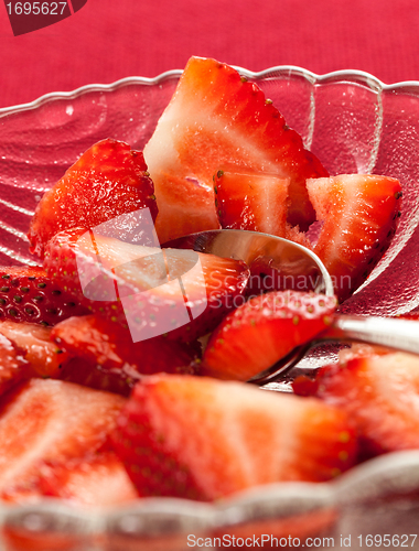 Image of Fresh sliced strawberries in glass dish