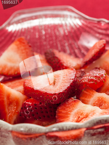 Image of Fresh sliced strawberries in glass dish