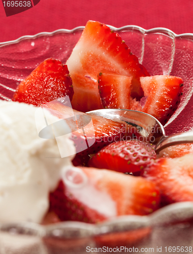 Image of Fresh sliced strawberries in glass dish