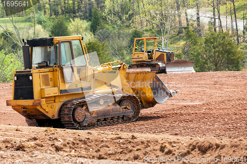 Image of Large earth mover digger clearing land