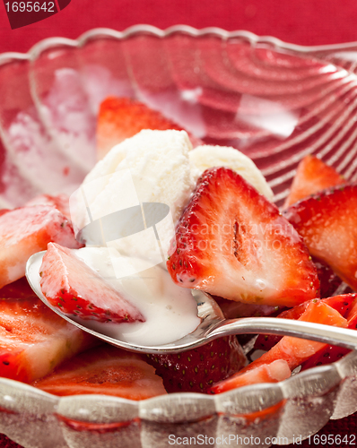 Image of Fresh sliced strawberries in glass dish