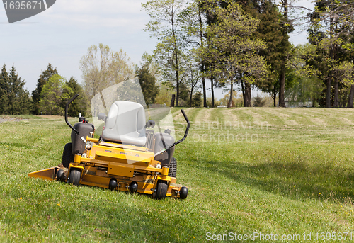 Image of Zero turn lawn mower on turf with no driver