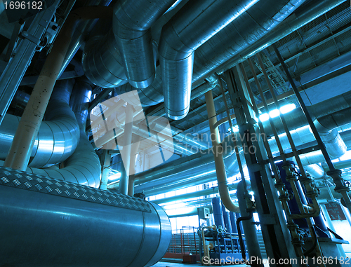 Image of Equipment, cables and piping as found inside of  industrial powe