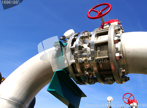 Image of Industrial zone, Steel pipelines and valves against blue sky