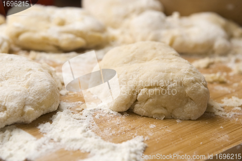 Image of Dough on wooden board