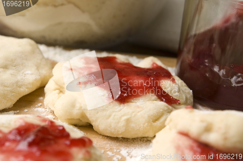 Image of Dough with marmelade on wooden board
