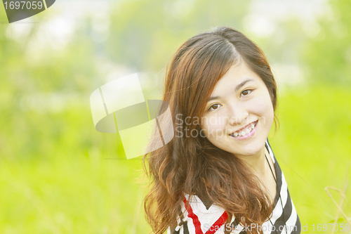 Image of Asian woman happy and smile
