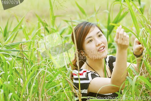 Image of Asian woman in the grasses