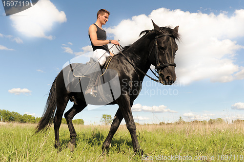 Image of young man and horse